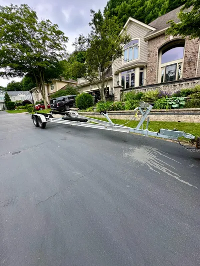  Yacht Photos Pics Trailer for 2023 Regal 2800 Bowrider parked on residential street.