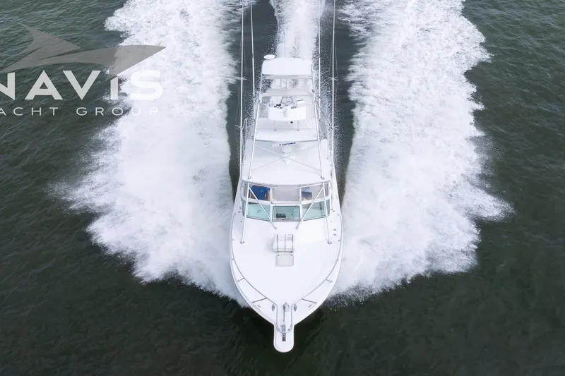 Pipe Dream Yacht Photos Pics Aerial view of 2005 Topaz 32 Express yacht cruising on water.