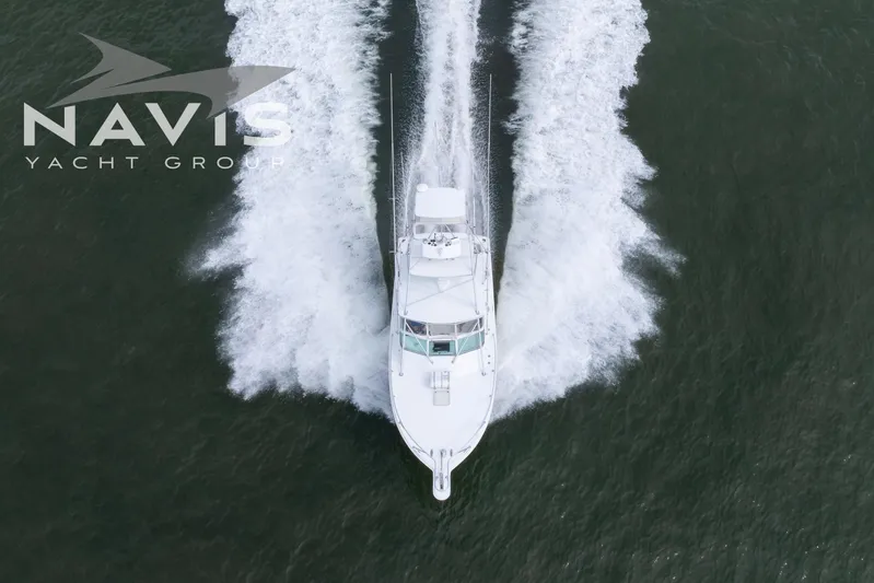 Pipe Dream Yacht Photos Pics Aerial view of 2005 Topaz 32 Express yacht cruising through water.