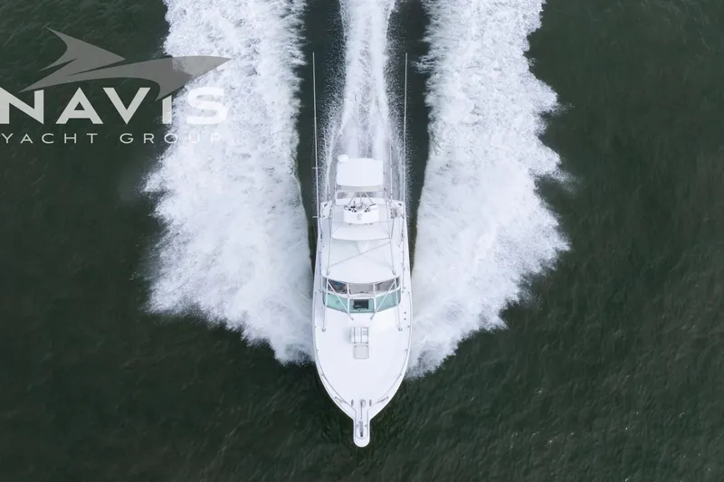 Pipe Dream Yacht Photos Pics Aerial view of 2005 Topaz 32 Express yacht cruising on water.