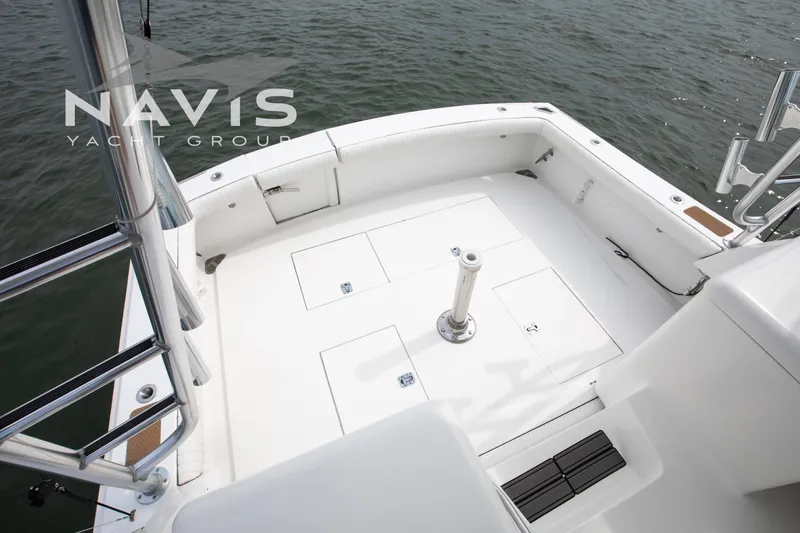 Pipe Dream Yacht Photos Pics 2005 Topaz 32 Express yacht deck with storage compartments, overlooking water.