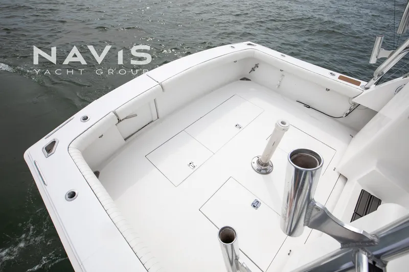 Pipe Dream Yacht Photos Pics 2005 Topaz 32 Express yacht deck with rod holders and storage compartments.