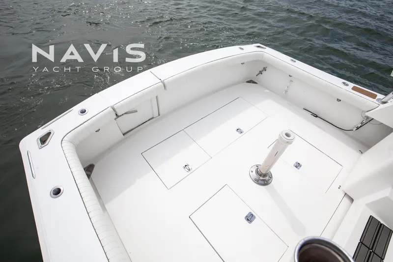 Pipe Dream Yacht Photos Pics 2005 Topaz 32 Express yacht deck with storage compartments, surrounded by water.