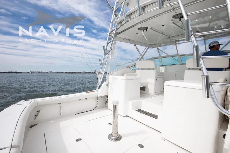 Pipe Dream Yacht Photos Pics 2005 Topaz 32 Express yacht deck with seating, ocean view, and clear sky.