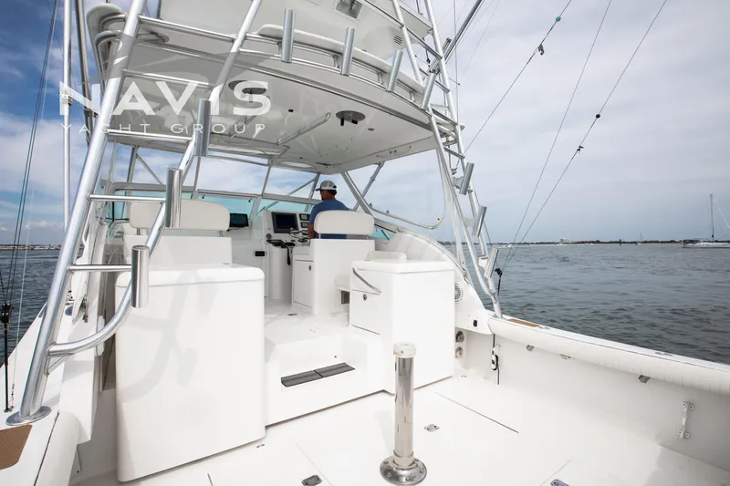 Pipe Dream Yacht Photos Pics 2005 Topaz 32 Express yacht cockpit with helm, ocean view, and modern design.