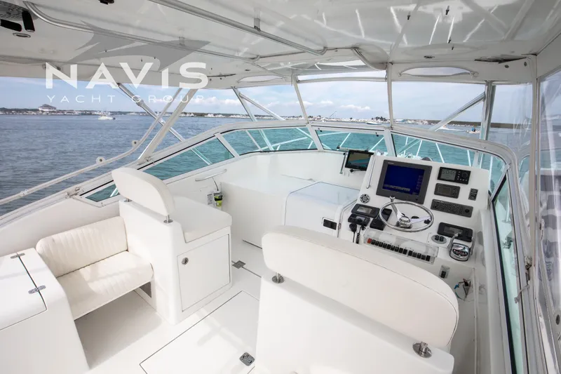 Pipe Dream Yacht Photos Pics 2005 Topaz 32 Express yacht cockpit with navigation equipment and ocean view.