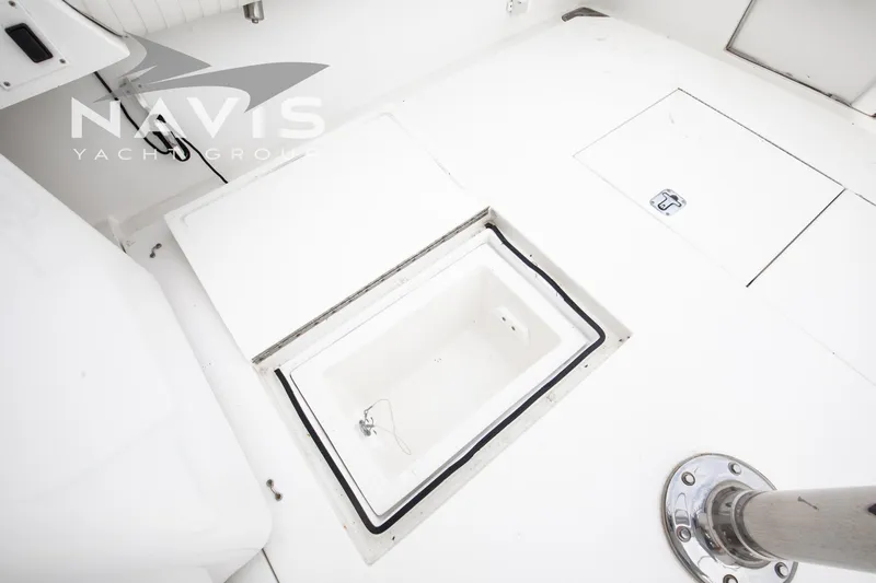 Pipe Dream Yacht Photos Pics 2005 Topaz 32 Express yacht deck with storage compartments and stainless steel fixtures.