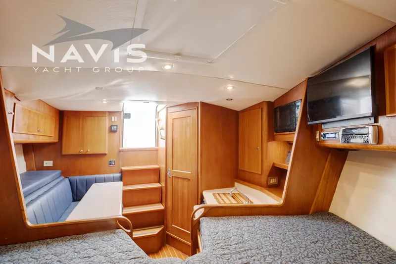 Pipe Dream Yacht Photos Pics Interior of 2005 Topaz 32 Express yacht with wood finish and modern amenities.