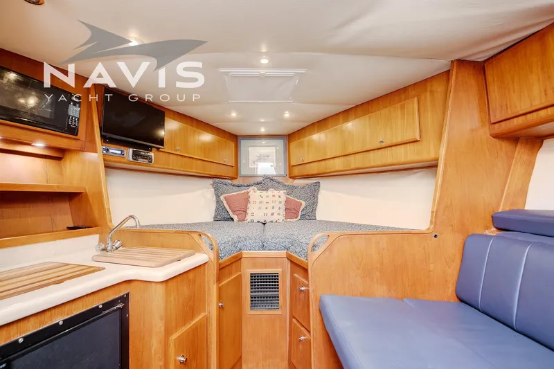 Pipe Dream Yacht Photos Pics Luxurious interior of 2005 Topaz 32 Express yacht with cozy cabin and modern amenities.