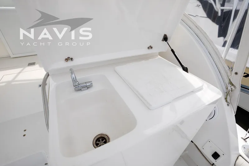 Pipe Dream Yacht Photos Pics 2005 Topaz 32 Express yacht sink and cutting board in cockpit area.