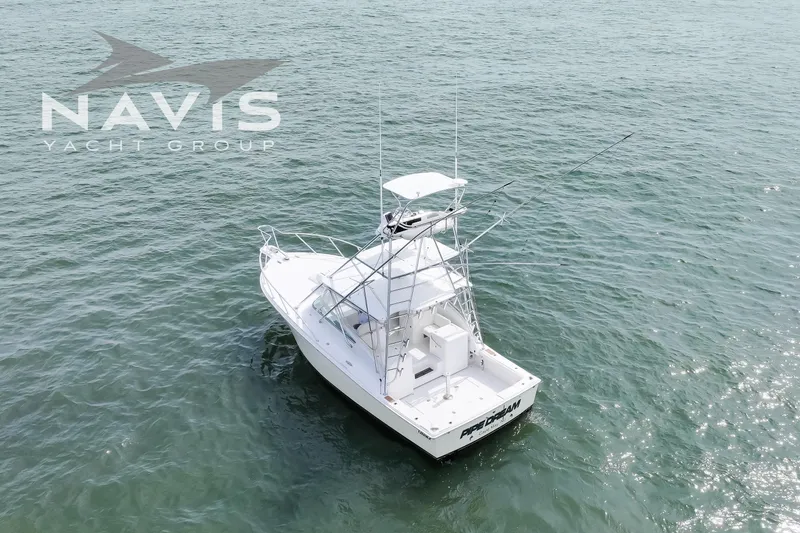 Pipe Dream Yacht Photos Pics 2005 Topaz 32 Express yacht on open water, aerial view.