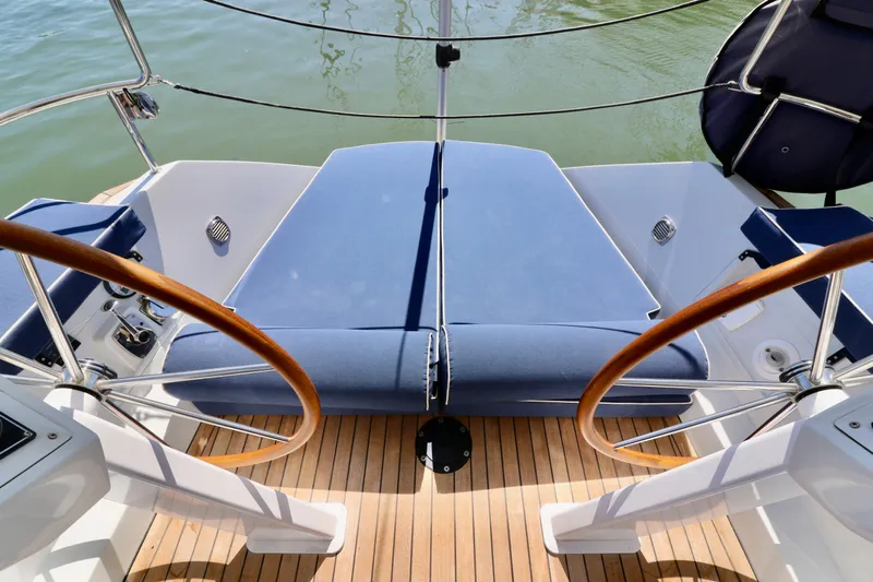  Yacht Photos Pics 2022 Jezequel Design 45 Classic yacht with dual wooden steering wheels and blue seating.