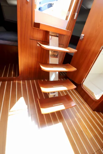  Yacht Photos Pics Interior of 2022 Jezequel design 45 Classic yacht with wooden stairs and flooring.