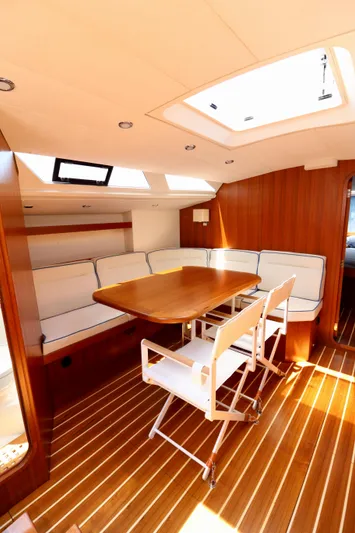  Yacht Photos Pics Luxurious interior of 2022 Jezequel design 45 Classic yacht with wooden flooring and seating.
