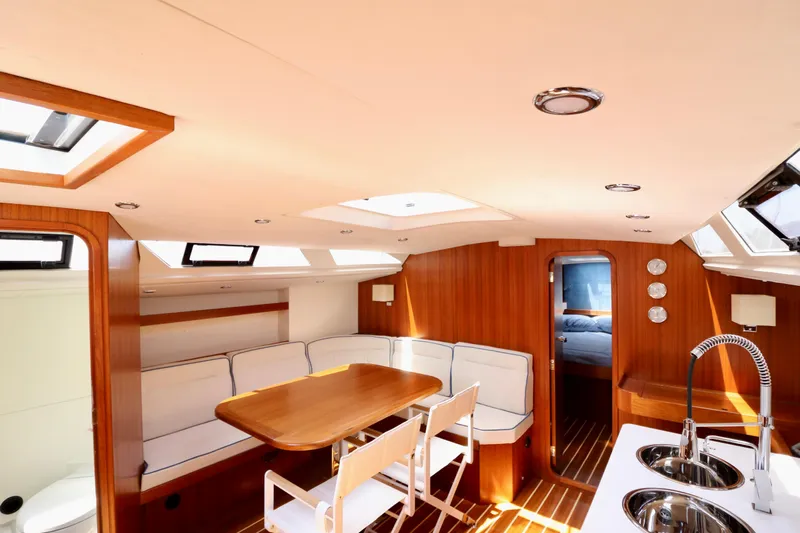  Yacht Photos Pics Luxurious interior of 2022 Jezequel Design 45 Classic yacht with elegant wood finish.