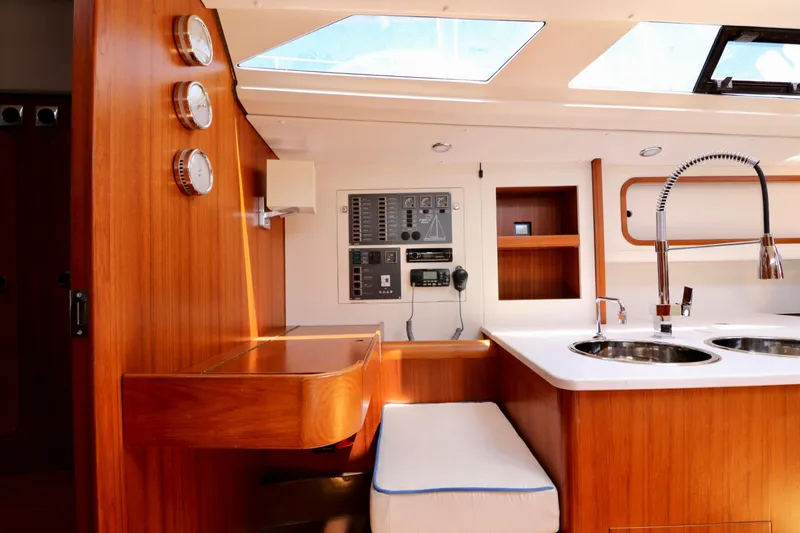  Yacht Photos Pics Interior of 2022 Jezequel Design 45 Classic yacht with wooden finish and modern amenities.
