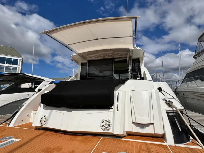  Yacht Photos Pics 2014 Cruisers Yachts 45 Cantius docked, showcasing sleek design and spacious deck.
