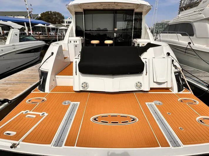  Yacht Photos Pics 2014 Cruisers Yachts 45 Cantius with spacious deck and modern design at marina.