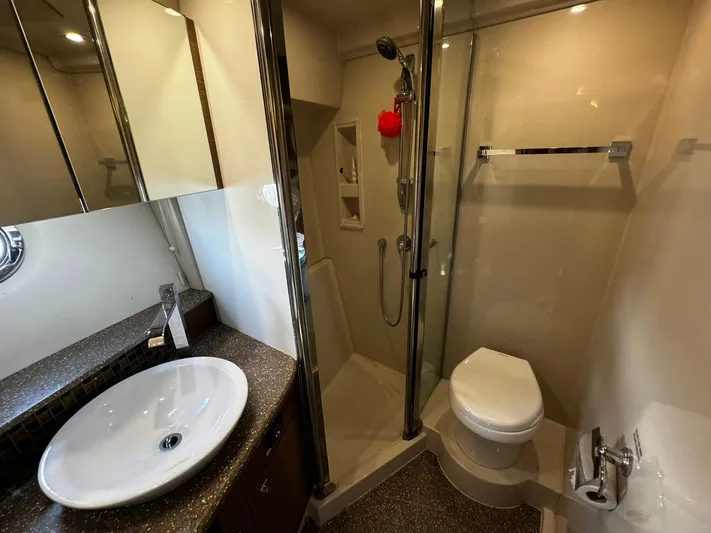  Yacht Photos Pics Luxurious bathroom in 2014 Cruisers Yachts 45 Cantius with modern fixtures and glass shower.