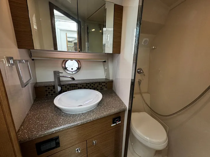  Yacht Photos Pics Luxurious bathroom in 2014 Cruisers Yachts 45 Cantius with modern fixtures and elegant design.