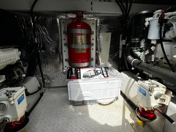  Yacht Photos Pics Engine room of 2014 Cruisers Yachts 45 Cantius with fire suppression system and equipment.