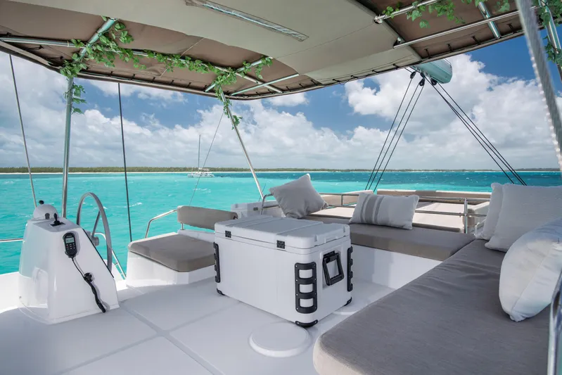 Bella Yacht Photos Pics Luxurious Bali 4.8 catamaran deck with seating, ocean view, and clear blue skies.