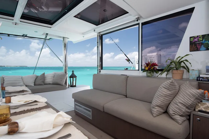 Bella Yacht Photos Pics Luxurious interior of 2021 Bali 4.8 yacht with ocean view and elegant seating.