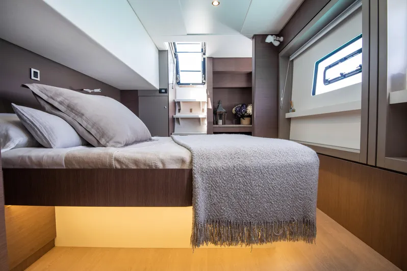 Bella Yacht Photos Pics Luxurious cabin interior of 2021 Bali 4.8 yacht with modern bedding and natural light.