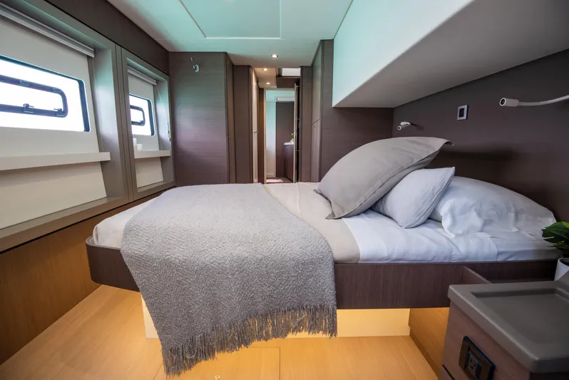 Bella Yacht Photos Pics Luxurious bedroom interior of 2021 Bali 4.8 yacht with modern design and cozy bedding.