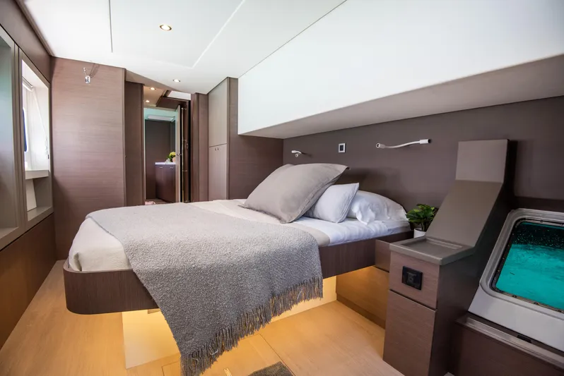 Bella Yacht Photos Pics Luxurious bedroom interior of 2021 Bali 4.8 yacht with modern design and ocean view.