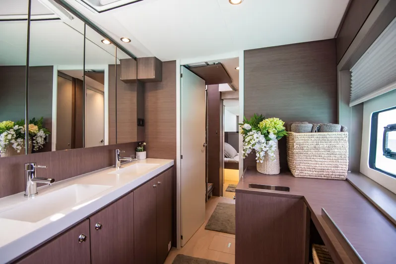 Bella Yacht Photos Pics Luxurious bathroom interior of 2021 Bali 4.8 yacht with dual sinks and elegant decor.