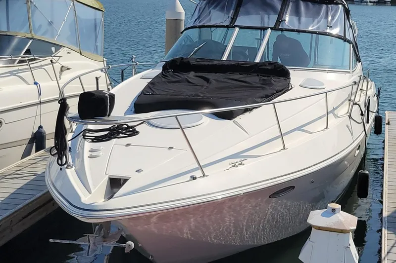 Grand Cru Yacht Photos Pics 2005 Cruisers Yachts 340 Express docked at marina, featuring sleek design and covered seating area.