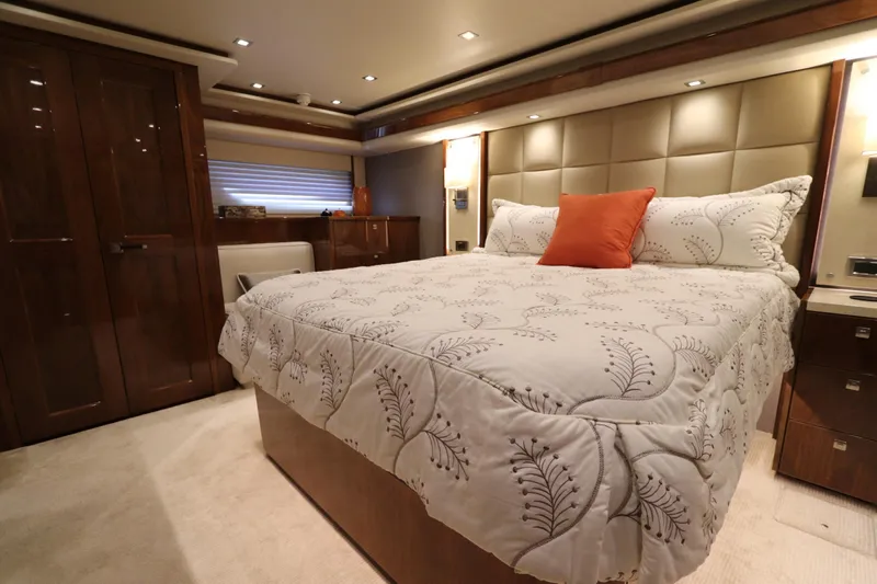 Stress Release Yacht Photos Pics Luxurious bedroom interior of 2017 Viking 80 Enclosed Bridge yacht with elegant bedding.
