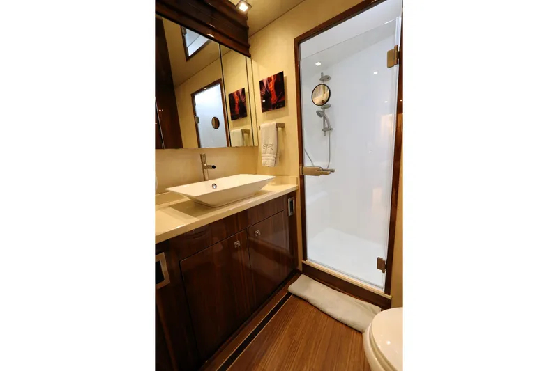 Stress Release Yacht Photos Pics Luxurious bathroom in 2017 Viking 80 Enclosed Bridge yacht with modern fixtures.