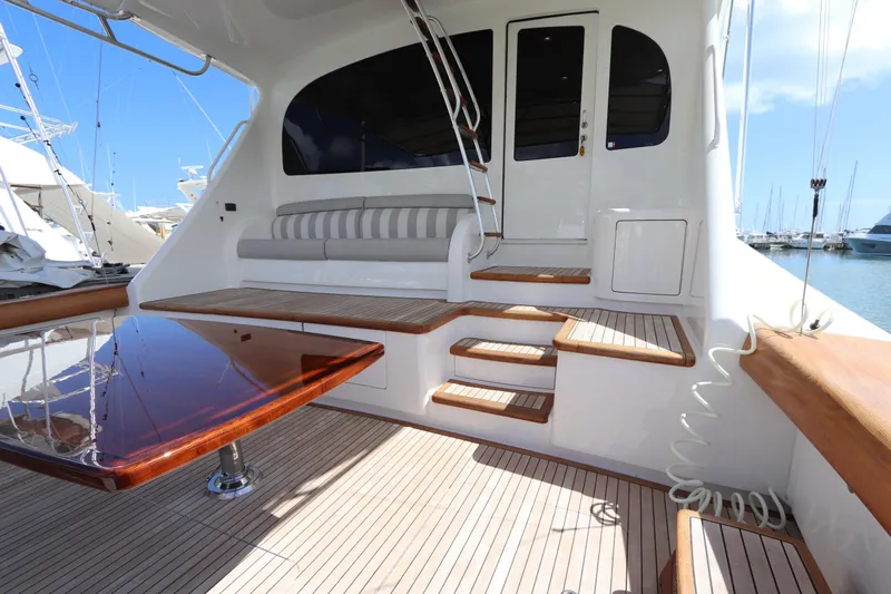 Stress Release Yacht Photos Pics Luxurious 2017 Viking 80 Enclosed Bridge yacht interior with elegant seating and polished wood table.