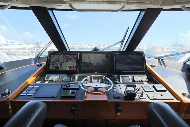 Stress Release Yacht Photos Pics Cockpit of 2017 Viking 80 Enclosed Bridge yacht with advanced navigation systems.