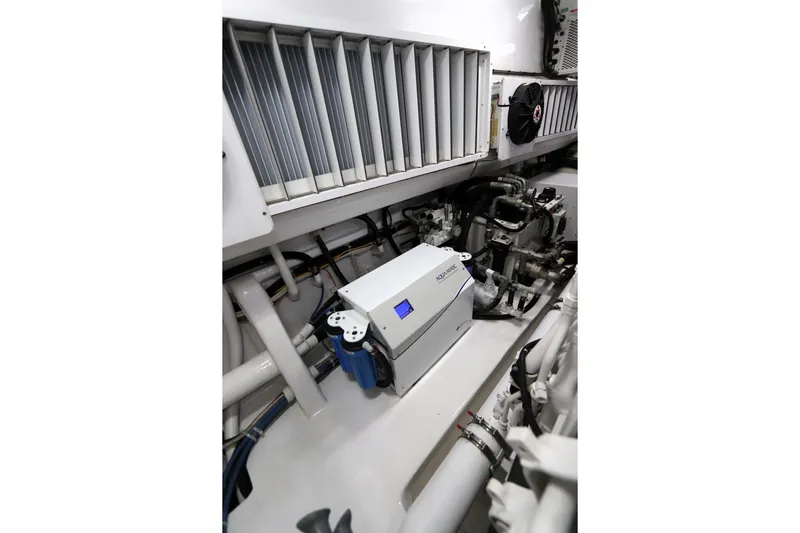 Stress Release Yacht Photos Pics Engine room of 2017 Viking 80 Enclosed Bridge yacht, featuring advanced machinery and equipment.