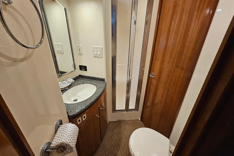 Paradox Yacht Photos Pics Luxurious bathroom in 2000 Carver 530 Voyager Pilothouse yacht with modern amenities.