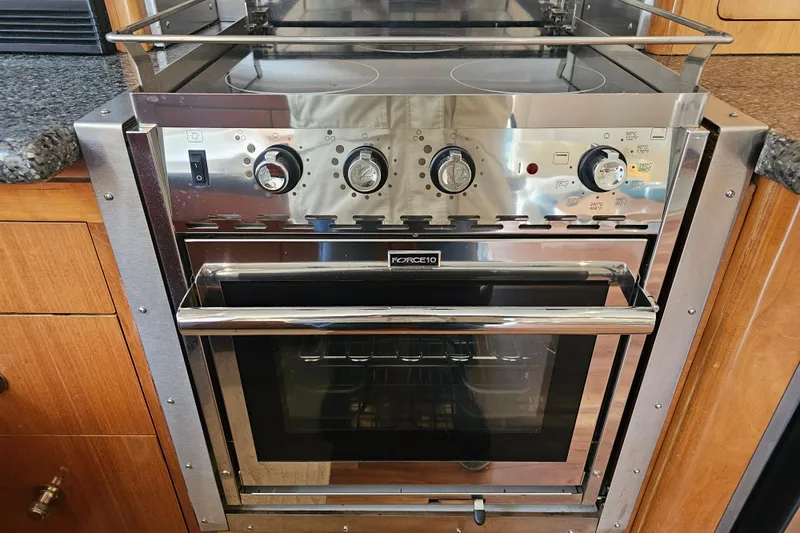 Paradox Yacht Photos Pics Stainless steel oven and stove in 2000 Carver 530 Voyager Pilothouse kitchen.