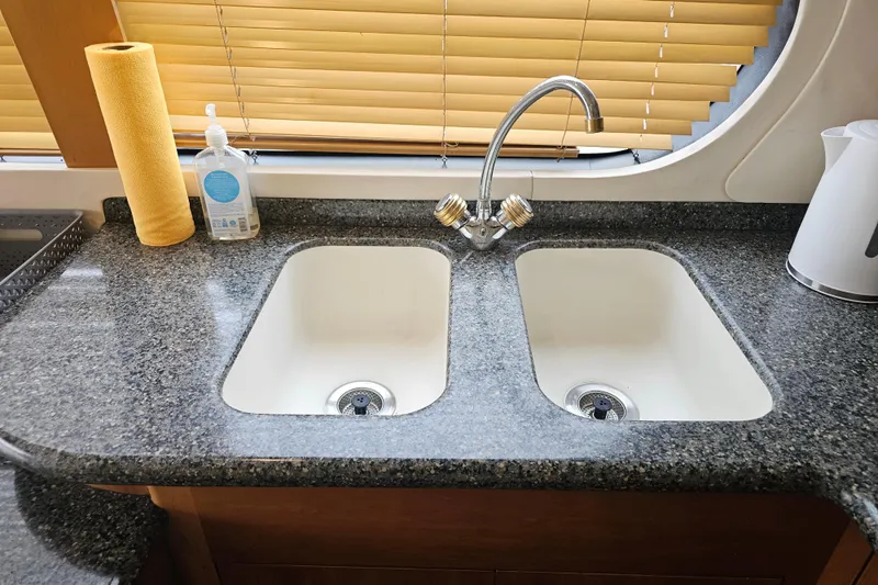 Paradox Yacht Photos Pics Dual kitchen sink in 2000 Carver 530 Voyager Pilothouse with granite countertop.