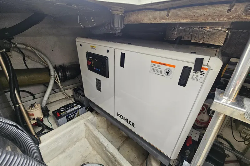 Paradox Yacht Photos Pics Engine room of 2000 Carver 530 Voyager Pilothouse with Kohler generator.