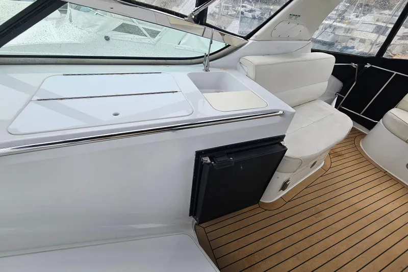 Paradox Yacht Photos Pics Interior of 2000 Carver 530 Voyager Pilothouse with seating and kitchenette area.