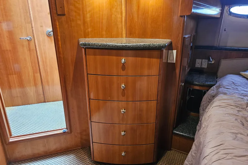 Paradox Yacht Photos Pics Interior of 2000 Carver 530 Voyager Pilothouse with wooden drawers and granite countertop.