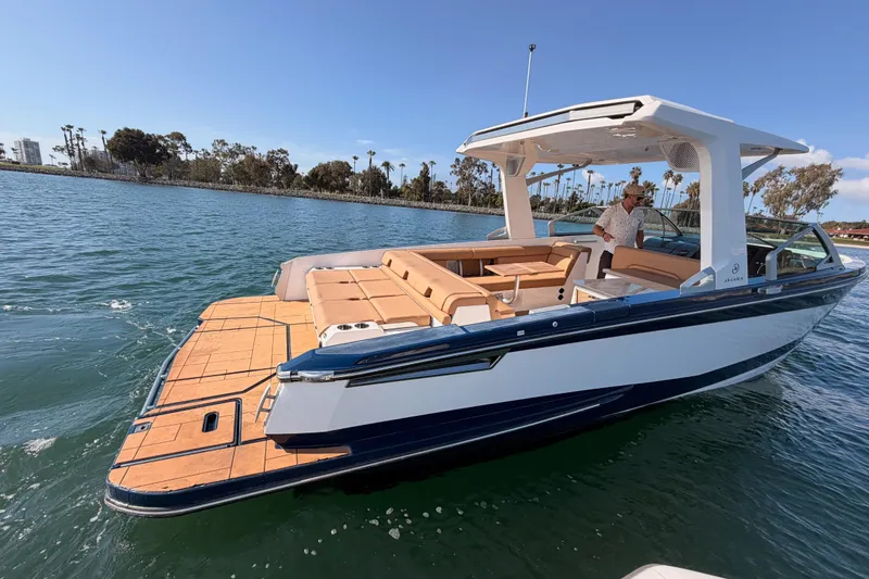 Wonder Why Yacht Photos Pics 2022 Aviara AV32 I/O boat on water, featuring sleek design and spacious seating.