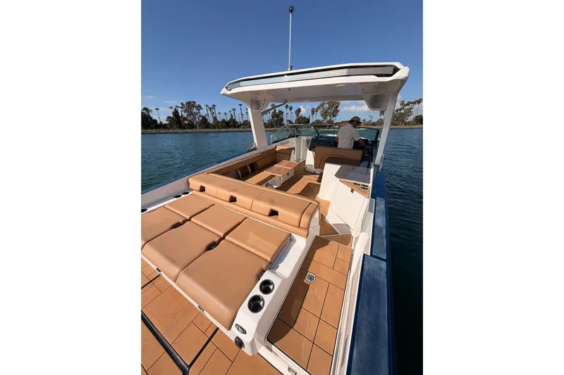 Wonder Why Yacht Photos Pics 2022 Aviara AV32 I/O luxury boat with tan seating on a sunny day.