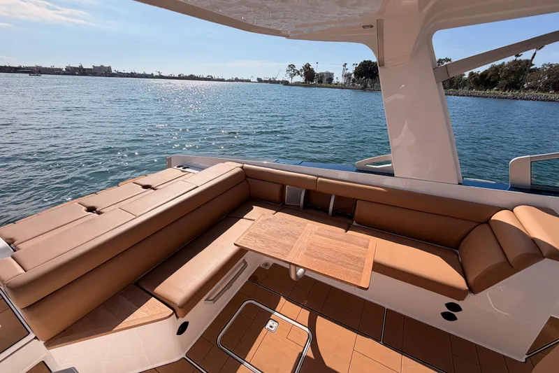 Wonder Why Yacht Photos Pics Luxurious seating area on 2022 Aviara AV32 I/O boat, overlooking serene waters.