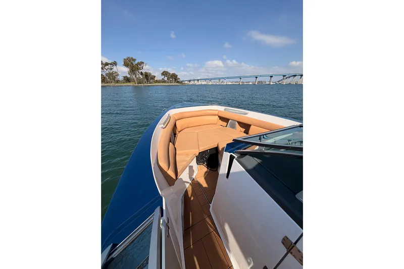 Wonder Why Yacht Photos Pics 2022 Aviara AV32 I/O boat on water, featuring tan seating and scenic bridge view.