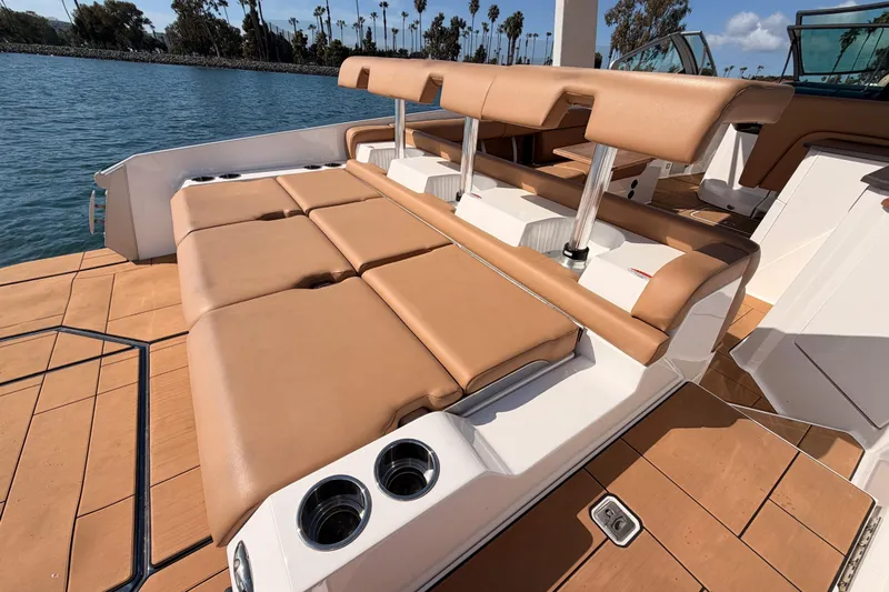 Wonder Why Yacht Photos Pics Luxury seating on 2022 Aviara AV32 I/O boat with tan upholstery and cup holders.