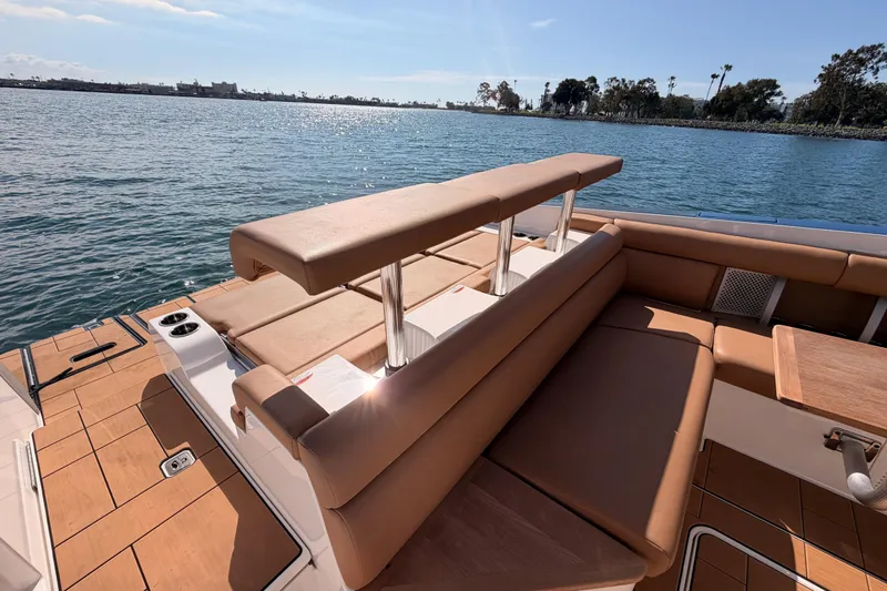 Wonder Why Yacht Photos Pics 2022 Aviara AV32 I/O boat with luxurious seating, docked by a serene waterfront.