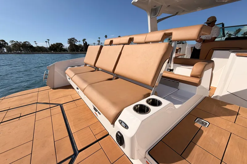 Wonder Why Yacht Photos Pics 2022 Aviara AV32 I/O boat with tan seating and cup holders on deck.
